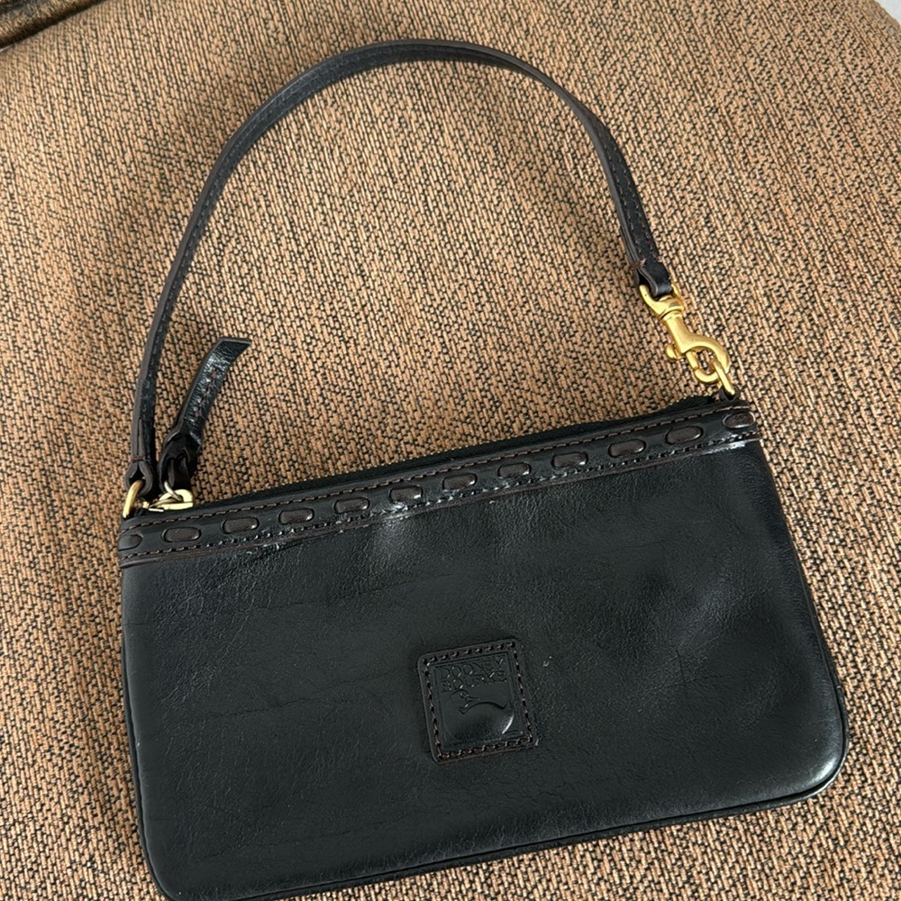 Dooney & Bourke small wristlet black with brown stitching in mint condition